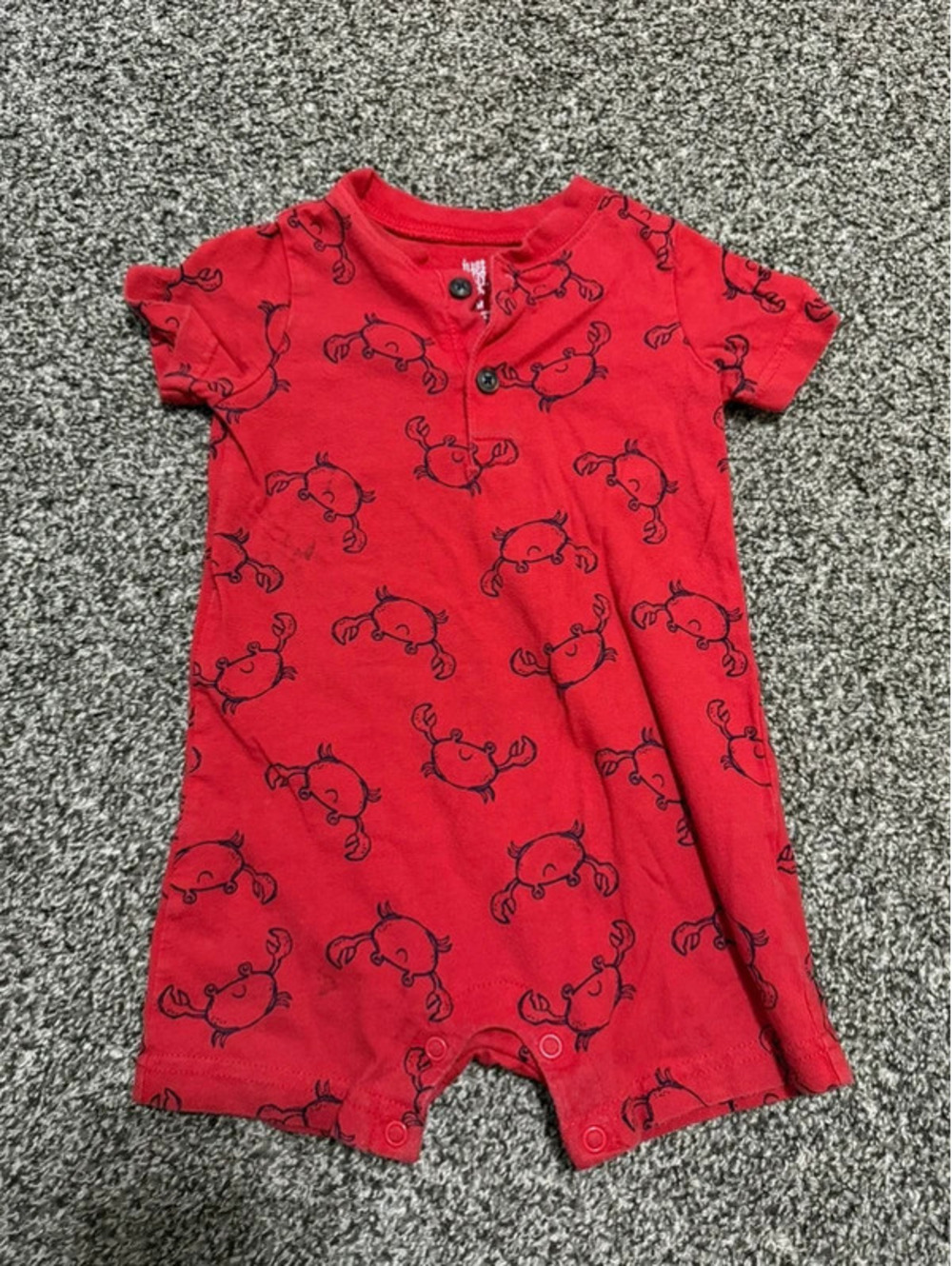Carter’s baby short-sleeve romper in red with an all-over black crab print